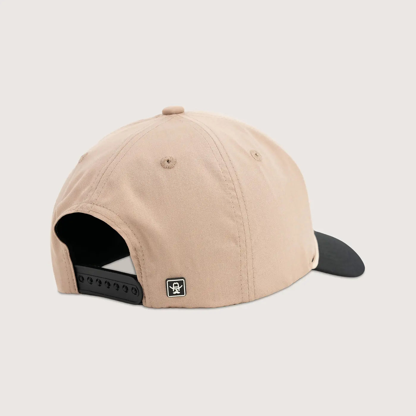 Tan Cowboy Cool western cap with black interior and visor on a light gray background