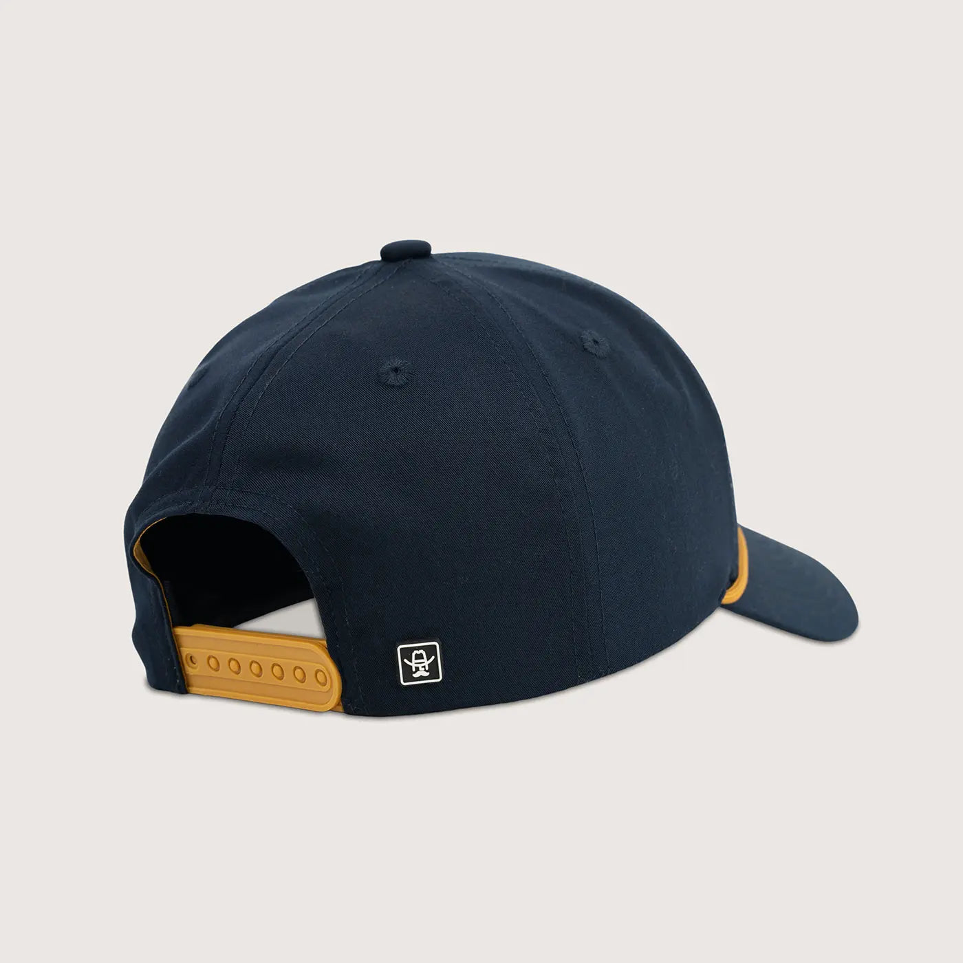 Navy blue cap with brown accents on a light gray background
