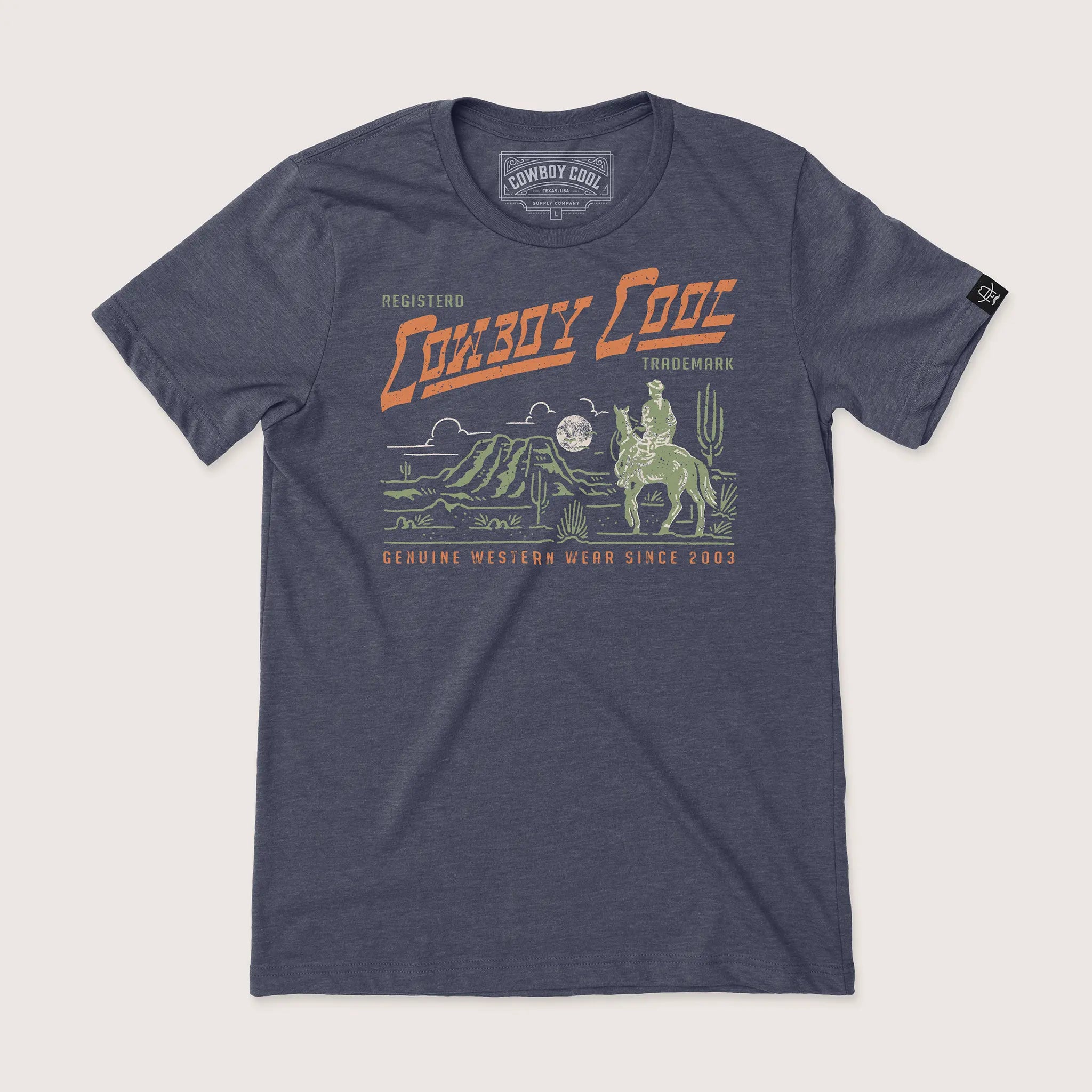 Cowboy Cool Lone Ranger T-Shirt in heather midnight navy, featuring a desert scene with cactus, mountains, and a cowboy riding under a full moon, with retro Western Wear design.