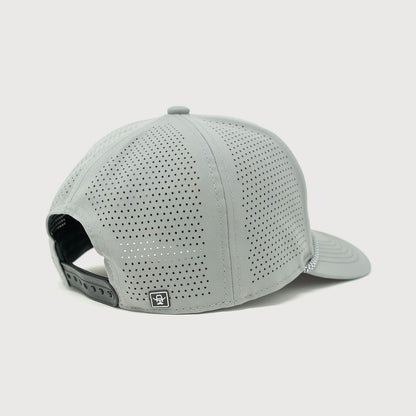 Back view of the Cowboy Cool Maverick Hat highlighting the perforated panels for breathability, adjustable snapback closure, and a small woven icon tag.