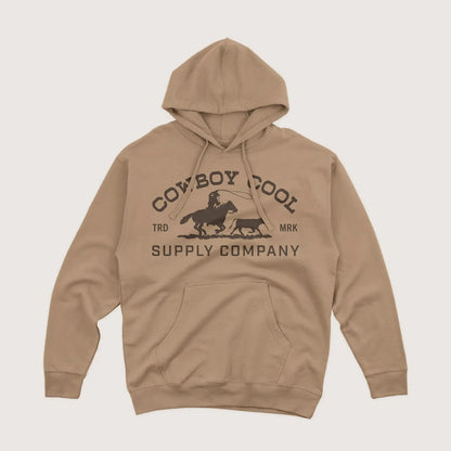 Cowboy Cool Roper Hoodie in sandstone featuring a cowboy roping cattle graphic and bold “Cowboy Cool Supply Company” chest print.