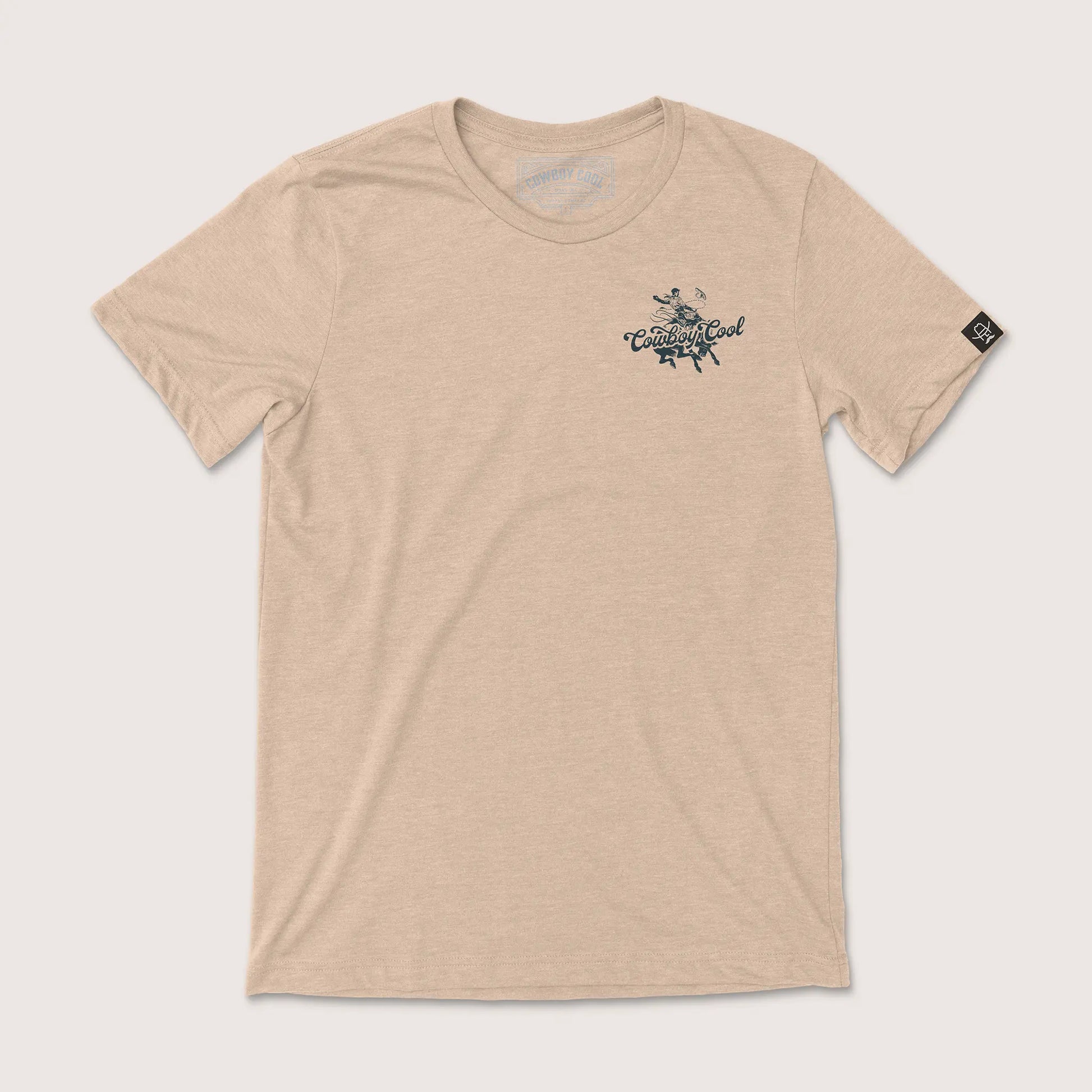 Cowboy Cool Legends T-Shirt in heather tan, featuring a vintage rodeo bronc rider graphic on the front.