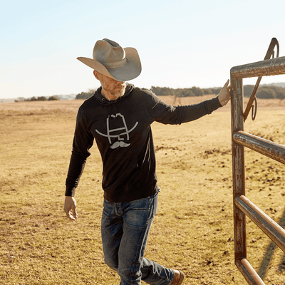 Man wearing a Cowboy Cool Hank Hoodie in Black.