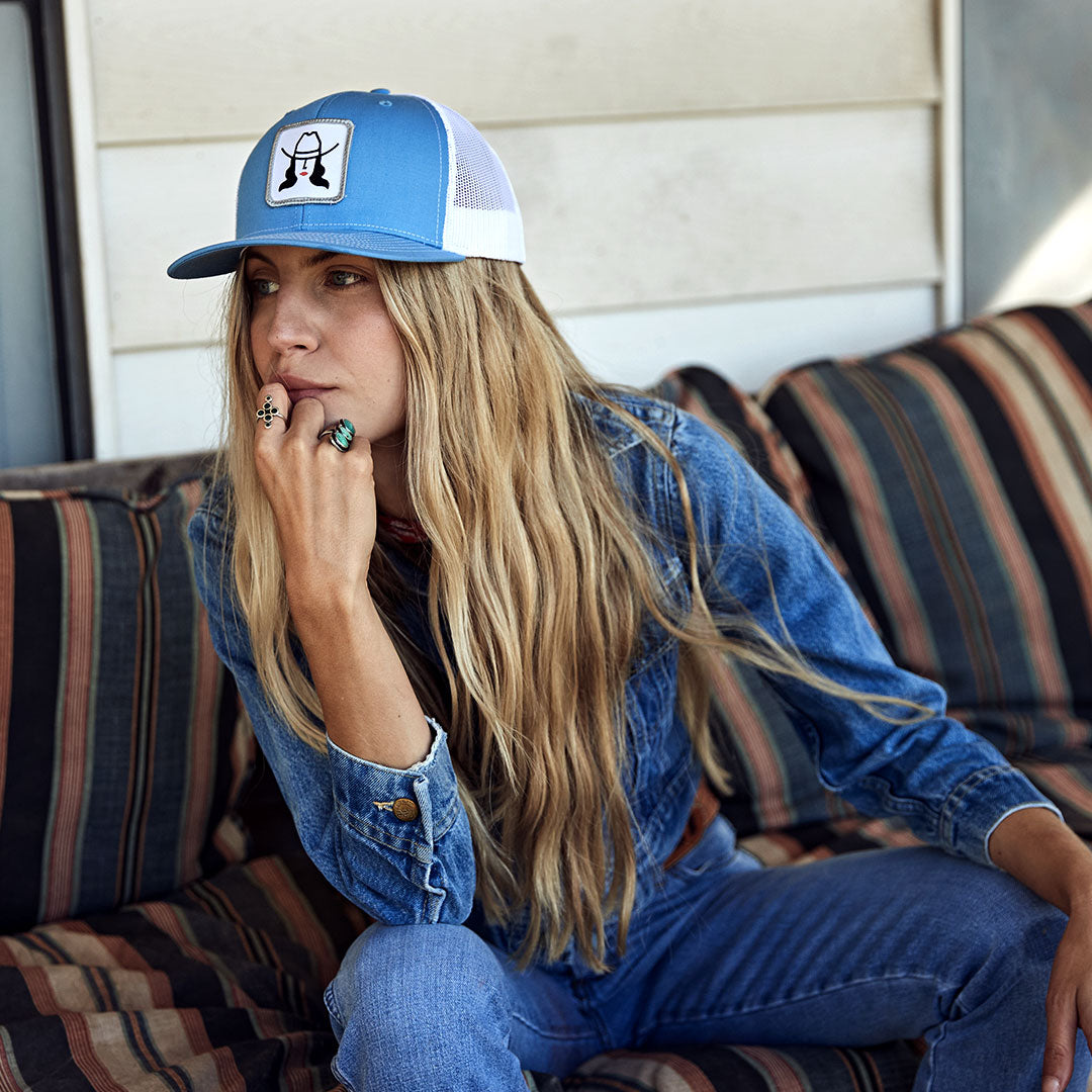 Model wearing a cowboy cool Loretta Hat in Columbia blue