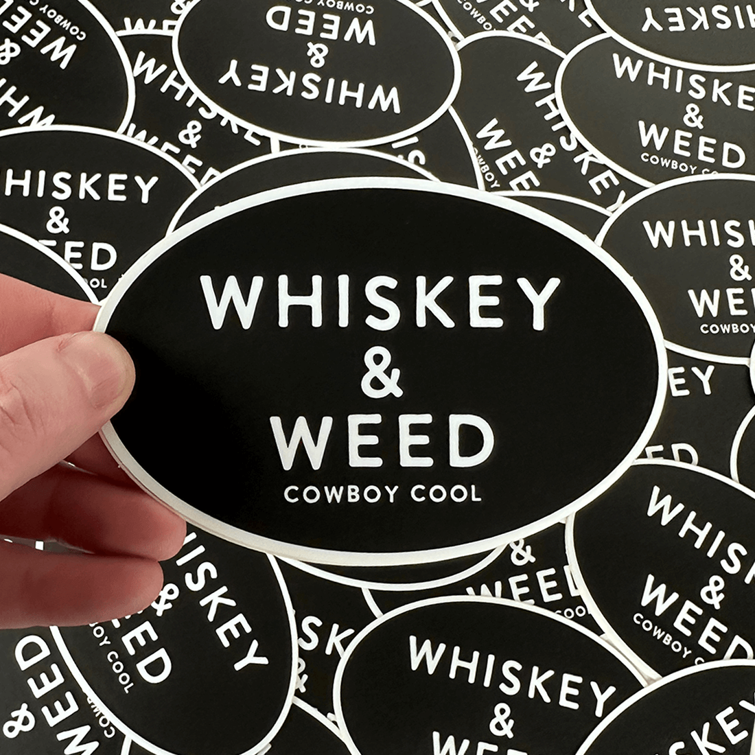 A picture of a hand holding a Cowboy Reserve Sticker 