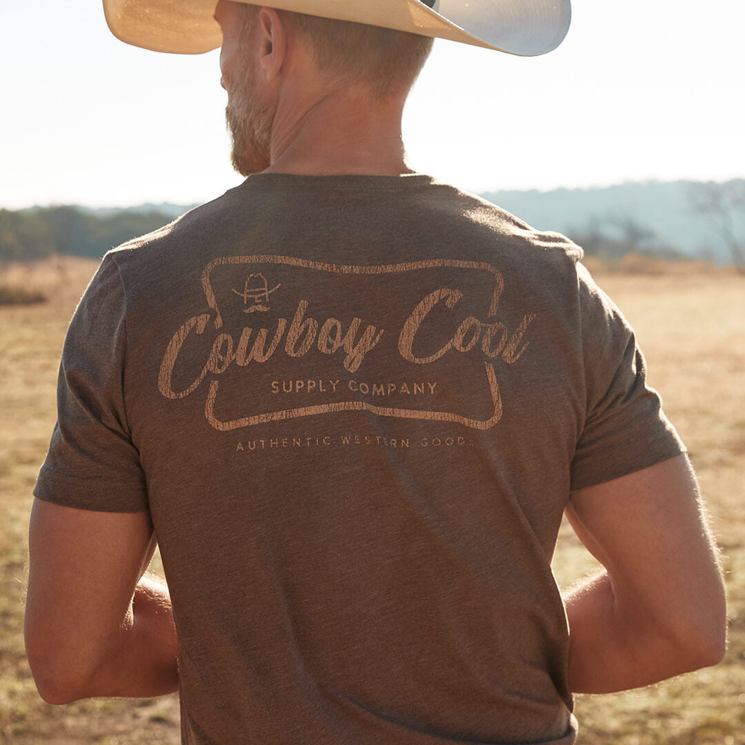 Back view of a model wearing a brown Cowboy Cool Vintage Beer T-Shirt